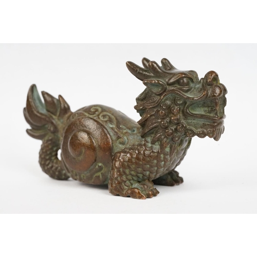 323 - An ornamental chinese bronze dragon figure.