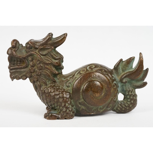 323 - An ornamental chinese bronze dragon figure.