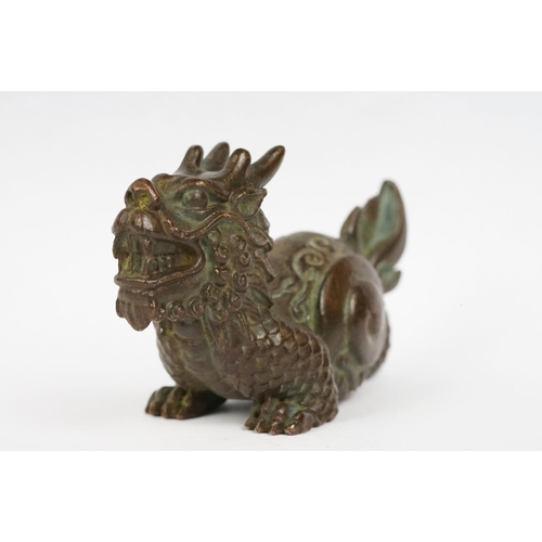 323 - An ornamental chinese bronze dragon figure.