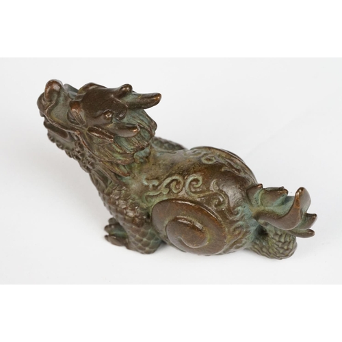 323 - An ornamental chinese bronze dragon figure.