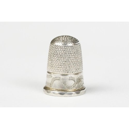 247 - Silver thimble containing smaller white metal thimble, in original silk and velvet lined leather cov... 