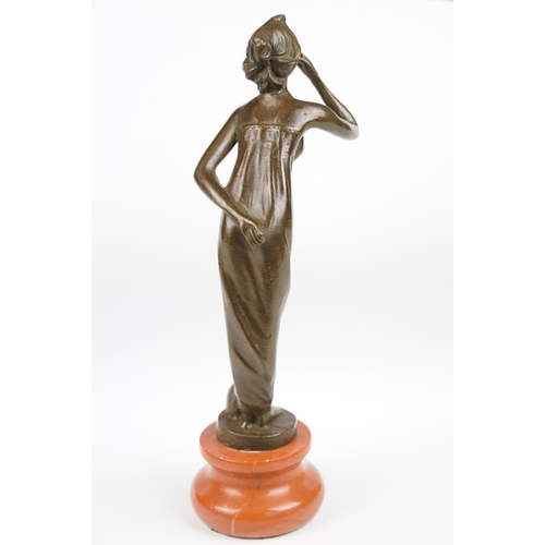 140 - Bronze Figure of an Art Deco style Lady on a stepped base, approx 21.5cm tall