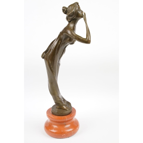 140 - Bronze Figure of an Art Deco style Lady on a stepped base, approx 21.5cm tall