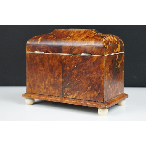 141 - 19th Century tortoiseshell twin compartment tea caddy, of sarcophagus form, with detailed mother of ... 