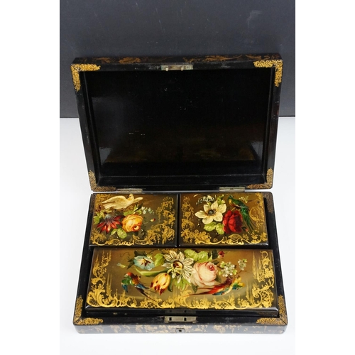 145 - 19th century black lacquered games box, the lid painted with exotic birds amongst flowers, with thre... 