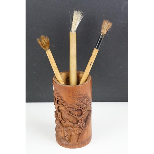 157 - Chinese Bamboo Carved Brush Pot together with three Bamboo handled Brushes