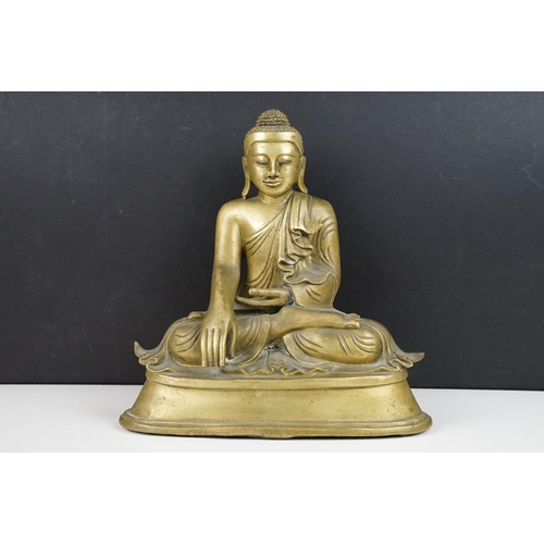 212 - Cast brass figure of a Thai seated Buddha, approx 25cm tall