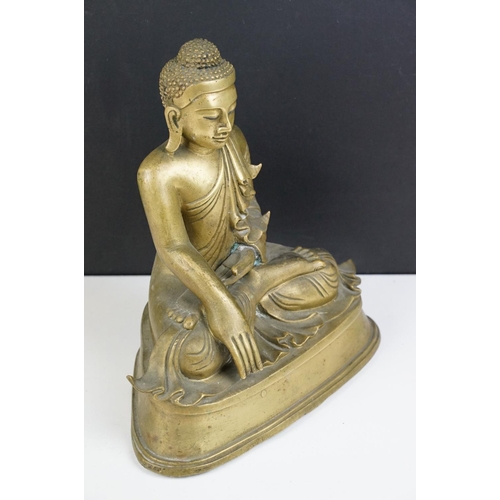 212 - Cast brass figure of a Thai seated Buddha, approx 25cm tall