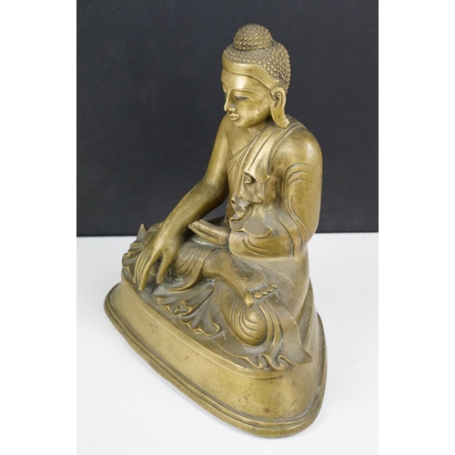 212 - Cast brass figure of a Thai seated Buddha, approx 25cm tall