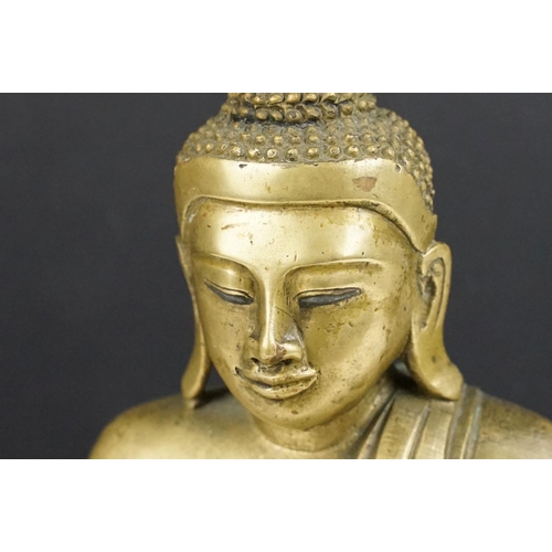 212 - Cast brass figure of a Thai seated Buddha, approx 25cm tall