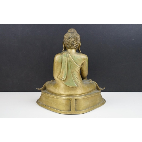 212 - Cast brass figure of a Thai seated Buddha, approx 25cm tall