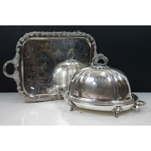 213 - Silver plated cloche of typical domed form with cast scroll handle, together with a silver plated wa... 