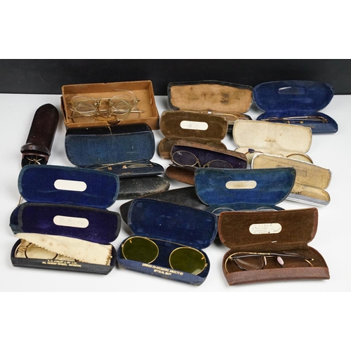 358 - A collection of cased vintage spectacles / eye glasses.