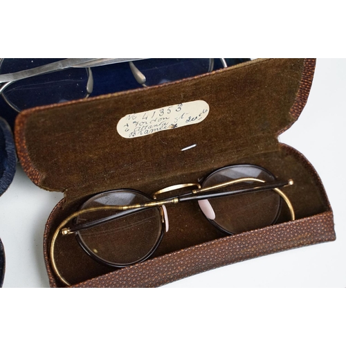 358 - A collection of cased vintage spectacles / eye glasses.