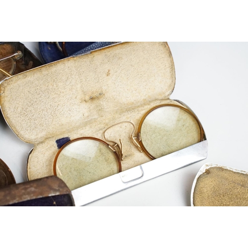 358 - A collection of cased vintage spectacles / eye glasses.