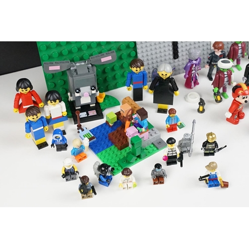 369 - A collection of mixed playmobil and lego to include minifigs.