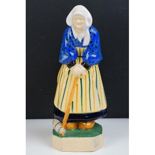 42 - Henriot Quimper figure of an elderly lady, circa 1930's, with polychrome decoration, designed by L. ... 