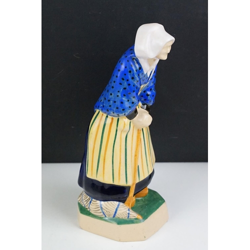 42 - Henriot Quimper figure of an elderly lady, circa 1930's, with polychrome decoration, designed by L. ... 