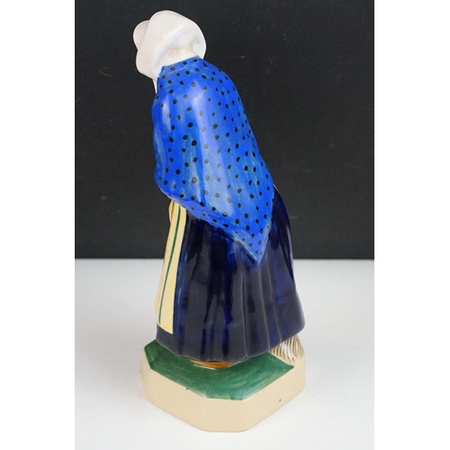 42 - Henriot Quimper figure of an elderly lady, circa 1930's, with polychrome decoration, designed by L. ... 