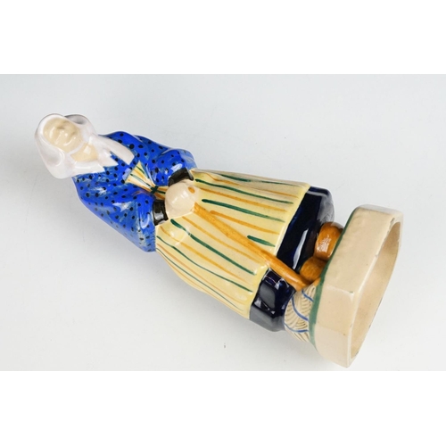 42 - Henriot Quimper figure of an elderly lady, circa 1930's, with polychrome decoration, designed by L. ... 