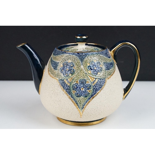 43 - William Moorcroft for Macintyre - Florian teapot, jug & stand, circa 1900, with green, blue & gilt f... 