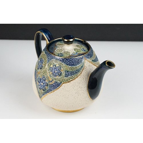 43 - William Moorcroft for Macintyre - Florian teapot, jug & stand, circa 1900, with green, blue & gilt f... 