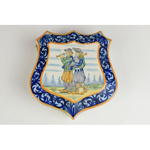 49 - Henriot Quimper faience shield-shaped box decorated with pipers (numbered 143), together with a Henr... 