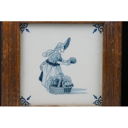 50 - Two Dutch Delft blue & white tiles, depicting a walking gentleman and lady with basket, wooden frame... 