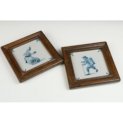 50 - Two Dutch Delft blue & white tiles, depicting a walking gentleman and lady with basket, wooden frame... 