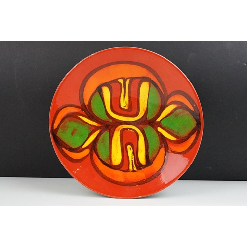 65 - Poole Pottery Delphis red ground shallow dish, appox 26.5cm diameter, monogram to reverse, shape no.... 