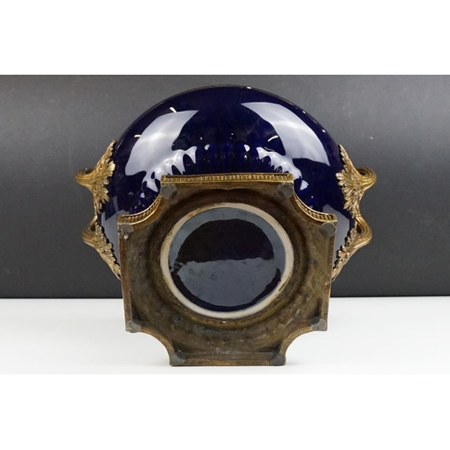 70 - Cobalt blue porcelain & bronze twin-handled centre bowl, with reeded bronze rim, raised on a quatref... 