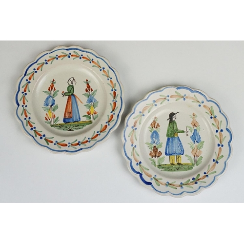 75 - Pair of late 19th / early 20th century Quimper dishes, with typical polychrome decoration of a man a... 