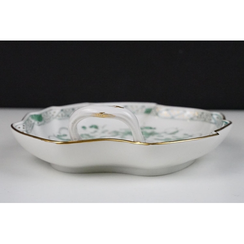 77 - Meissen porcelain leaf shaped dish, with hand painted green floral decoration, stem-form loop handle... 