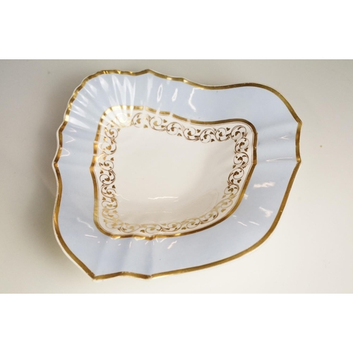 86 - 19th Century Victorian part dinner service having gilt and light blue rims, with scrolled foliate de... 