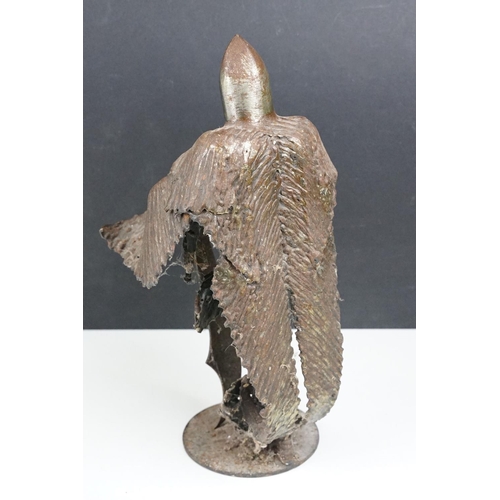 169 - Ron Lyon stylised metal sculpture of a Medieval knight, raised on a circular base, label to undersid... 