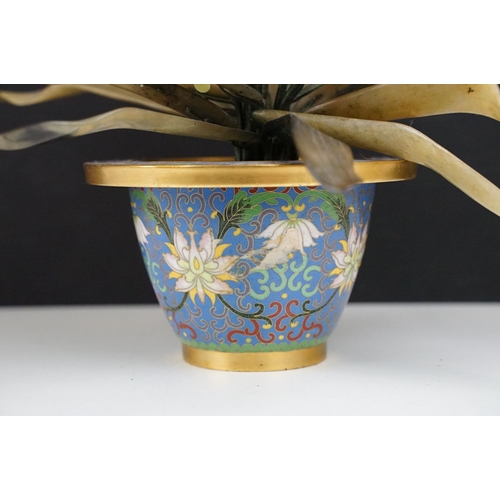 172 - Chinese Hardstone Flower held in a Cloisonne Bowl decorated with flowers on a blue ground, 43cm high