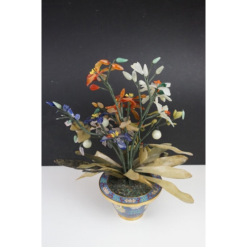 172 - Chinese Hardstone Flower held in a Cloisonne Bowl decorated with flowers on a blue ground, 43cm high