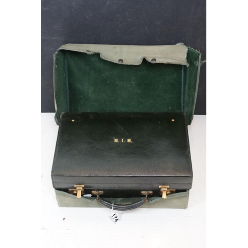 174 - Early 20th century travelling vanity case, the fitted interior with contents to include eight glass ... 