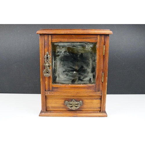 180 - Early 20th century pine smokers cabinet, the door with bevelled mirror to front, drawer below with c... 