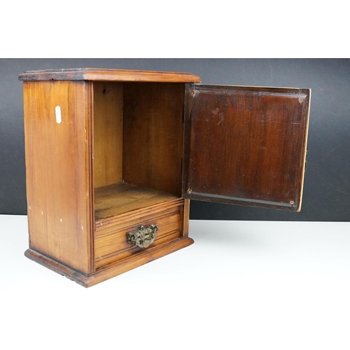 180 - Early 20th century pine smokers cabinet, the door with bevelled mirror to front, drawer below with c... 