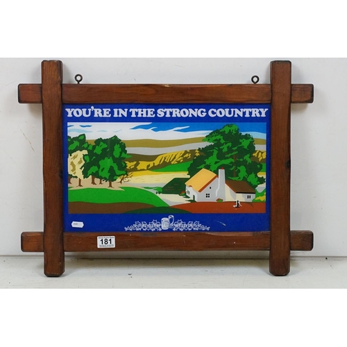 181 - ' You're In The Strong Country ' wooden framed hanging pub sign, approx 64cm W x 46.5cm H