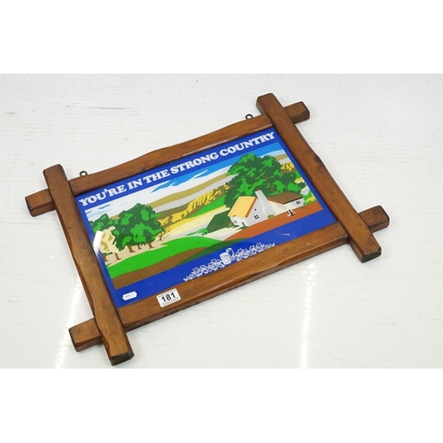 181 - ' You're In The Strong Country ' wooden framed hanging pub sign, approx 64cm W x 46.5cm H