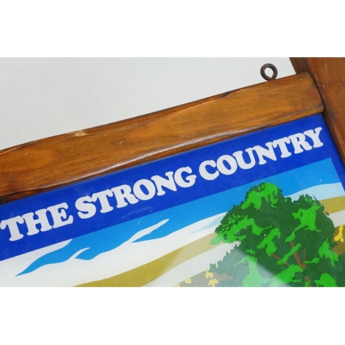 181 - ' You're In The Strong Country ' wooden framed hanging pub sign, approx 64cm W x 46.5cm H