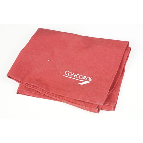 215 - A collection of Concorde memorabilia to include glasses case, cushion cover, folder, card case....et... 