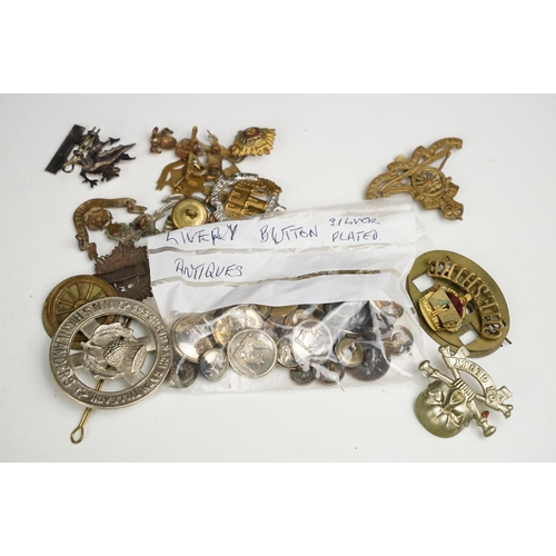 342 - A collection of mixed militaria to include badges, buttons, patches, dagger sporrans and uniform.