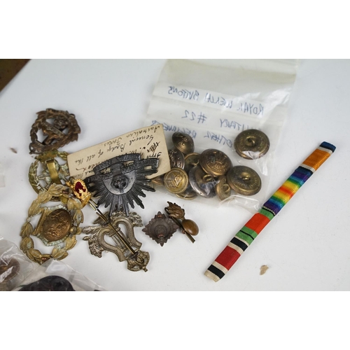 342 - A collection of mixed militaria to include badges, buttons, patches, dagger sporrans and uniform.