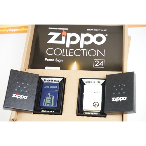 343 - A collection of unused Zippo pocket lighters together with display boxes.