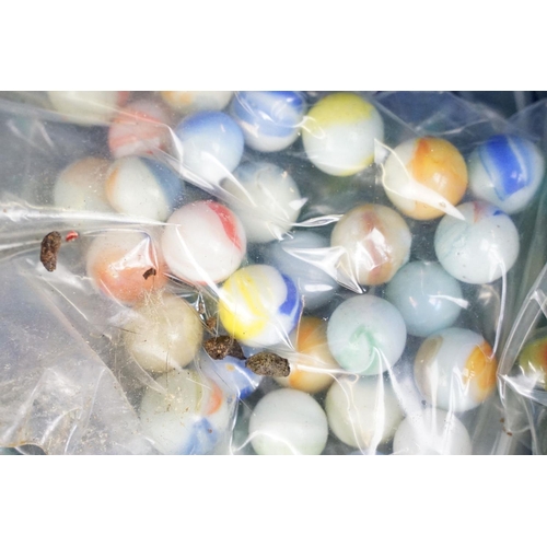 352 - A large collection of mixed marbles to include various colours and sizes.