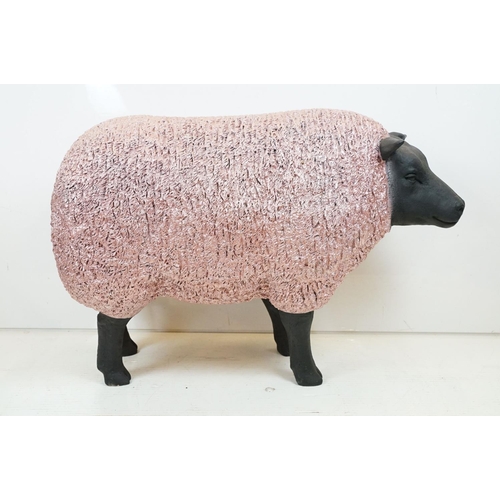 165 - Large painted fibreglass model of a sheep, in black & metallic pink. Measures approx 70cm H x 100cm ... 