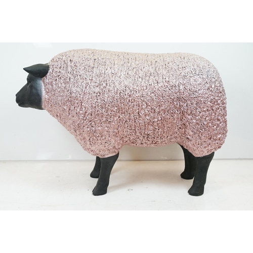 165 - Large painted fibreglass model of a sheep, in black & metallic pink. Measures approx 70cm H x 100cm ... 